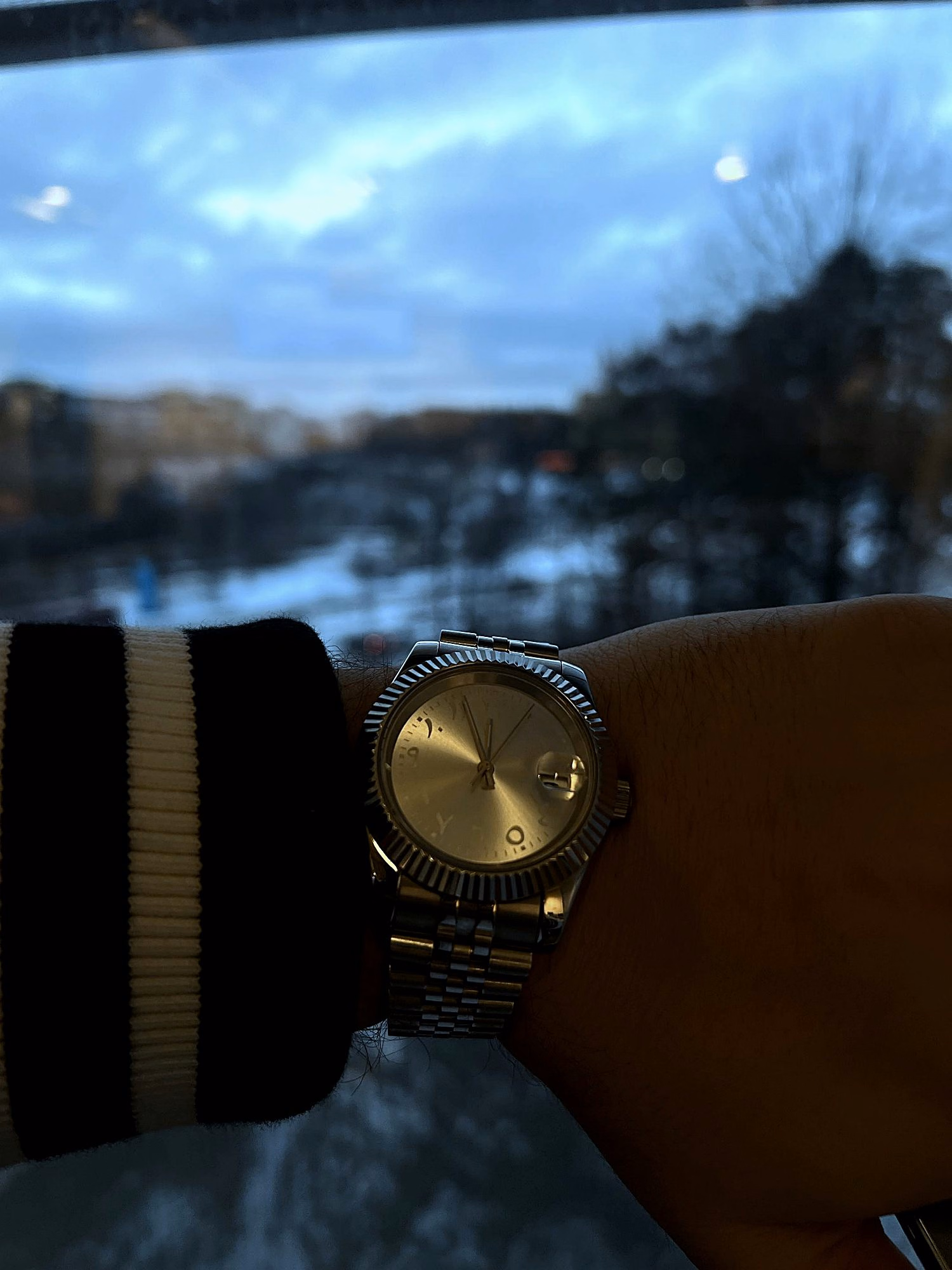 A 6F7 watch worn by a Stockholm window, presented in black and white.